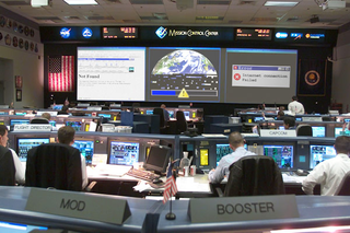 Frustrated Mission Control Center staff experience yet another dial-up disconnection while browsing the web Tuesday.